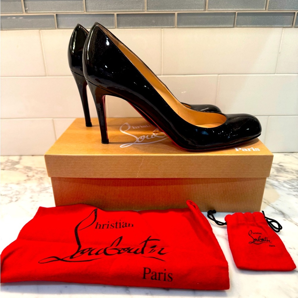 Christian Louboutin Patent Black Heels with Red Sole. Worn only a few times.